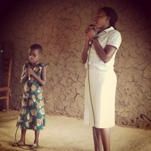 Esther leading worship in Karama