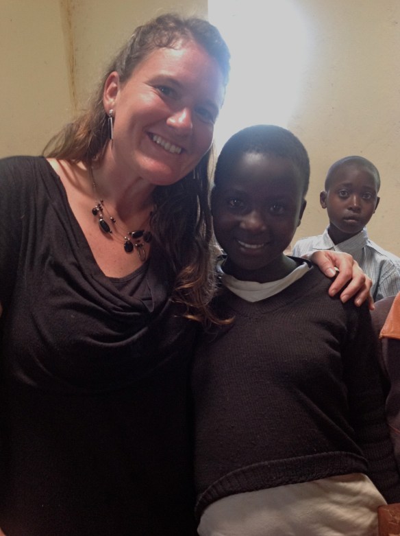 Costa is sponsored by a family from my church as well.  Her sponsor was on our first team to Uganda in 2010.  When she spotted me in church, Costa didn't stare at me and my white skin from afar like most of the children.  Instead, a big smile burst onto her face, and she boldly made her way across the church and sat next to me, as if she had reserved seating.