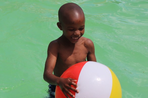 Taking a break from lessons in the big pool, and enjoying the shallow one.